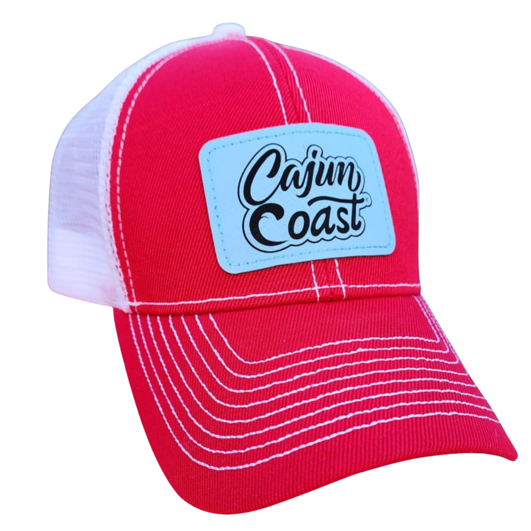 Red cap with a blue patch labeled 'Cajun Coast' on a white background