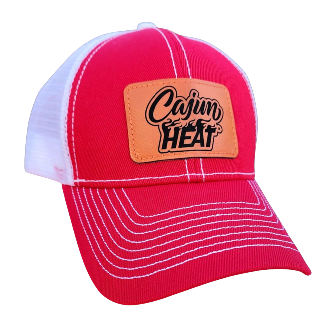 Red cap with a orange patch labeled 'Cajun Heat' on a white background